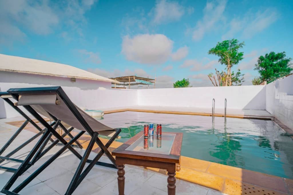 Lounge chairs beside the camp swimming pool